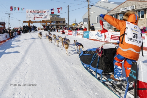 Last place finisher and Red Lantern Award winner Cindy Abbott holds up the red lantern as she runs down the finish chute in Nome during the 2017 Iditarod on Saturday March 18, 2017.

Photo by Jeff Schultz/SchultzPhoto.com  (C) 2017  ALL RIGHTS RESERVED